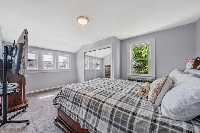 26 Rosedale Ave, Freeport, NY 11520 - bedroom featuring carpet, multiple windows, vaulted ceiling, and a closet