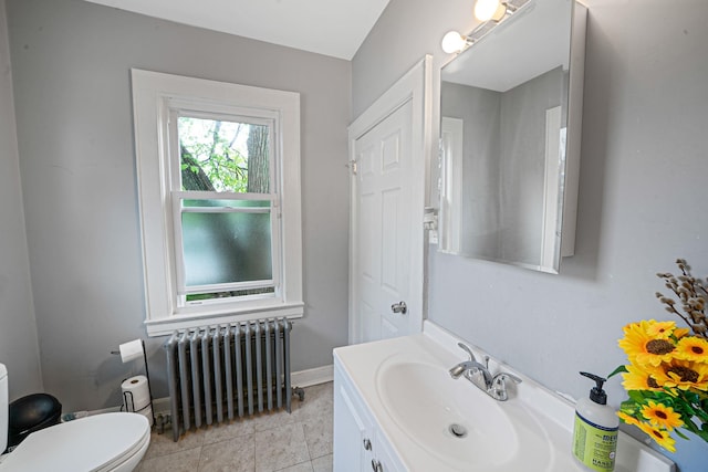 26 Rosedale Ave, Freeport, NY 11520 - bathroom with radiator heating unit, vanity, and tile patterned floors