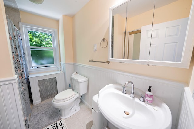 26 Rosedale Ave, Freeport, NY 11520 - full bath with a wainscoted wall, tile patterned floors, and a shower with curtain
