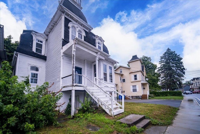 97 E Main St, Middletown, NY 10940 - view of side of home with stairway, covered porch, and mansard roof