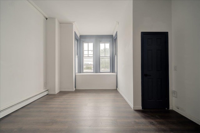 97 E Main St, Middletown, NY 10940 - unfurnished room featuring a baseboard heating unit, wood finished floors, and ornamental molding