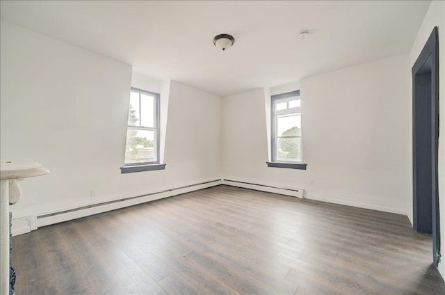 97 E Main St, Middletown, NY 10940 - empty room featuring plenty of natural light, wood finished floors, and a smoke detector