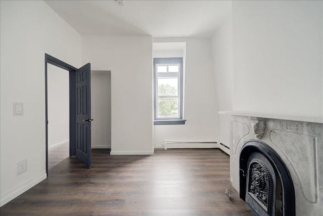 97 E Main St, Middletown, NY 10940 - unfurnished living room featuring baseboard heating and wood finished floors