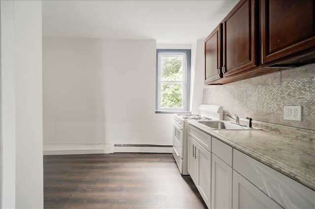 97 E Main St, Middletown, NY 10940 - kitchen featuring a baseboard heating unit, gas range gas stove, tasteful backsplash, wood finished floors, and light stone countertops