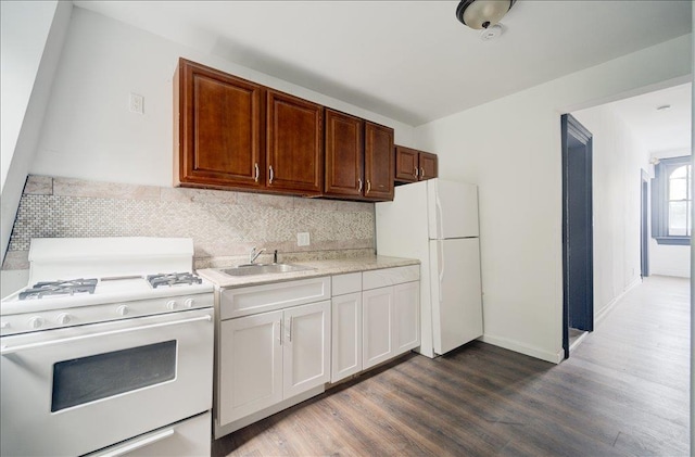97 E Main St, Middletown, NY 10940 - kitchen featuring white appliances, light countertops, dark wood finished floors, and tasteful backsplash