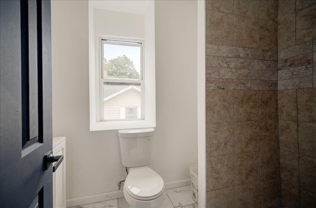97 E Main St, Middletown, NY 10940 - bathroom featuring marble look tiles and tiled shower