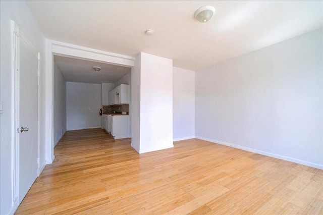 221 E Main St, Middletown, NY 10940 - spare room featuring light wood finished floors and a smoke detector