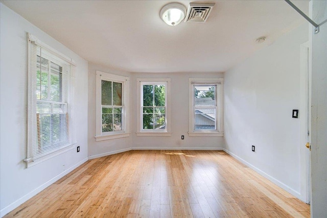 221 E Main St, Middletown, NY 10940 - spare room featuring healthy amount of natural light, light wood-style flooring, and a smoke detector