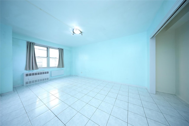 1935 Shore Pkwy Unit 1F, Brooklyn, NY 11214 - unfurnished room featuring radiator and light tile patterned flooring