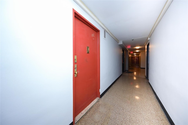 1935 Shore Pkwy Unit 1F, Brooklyn, NY 11214 - hallway with baseboards and dark speckled floor