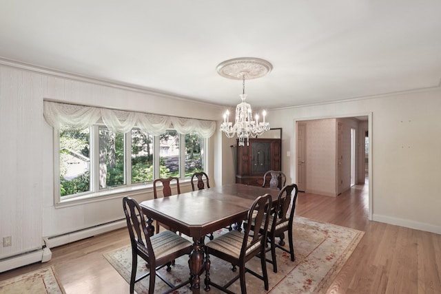 65 Winston Dr, Smithtown, NY 11787 - dining space with crown molding, a chandelier, a baseboard radiator, and light wood-type flooring