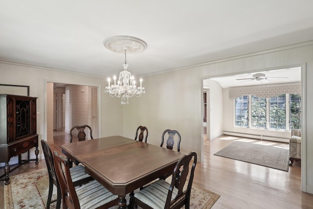 65 Winston Dr, Smithtown, NY 11787 - dining area featuring a baseboard heating unit, a chandelier, ornamental molding, light wood-style floors, and a ceiling fan