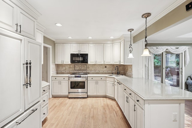 65 Winston Dr, Smithtown, NY 11787 - kitchen featuring stainless steel range oven, black microwave, paneled built in fridge, a peninsula, and light wood-type flooring