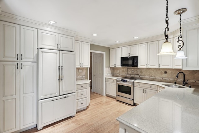 65 Winston Dr, Smithtown, NY 11787 - kitchen with black microwave, electric stove, paneled built in refrigerator, decorative light fixtures, and tasteful backsplash