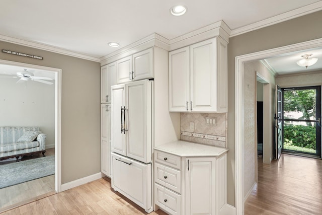 65 Winston Dr, Smithtown, NY 11787 - kitchen featuring paneled built in refrigerator, ornamental molding, light wood-style floors, backsplash, and recessed lighting