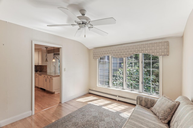 65 Winston Dr, Smithtown, NY 11787 - living room featuring a baseboard radiator, light wood finished floors, and ceiling fan