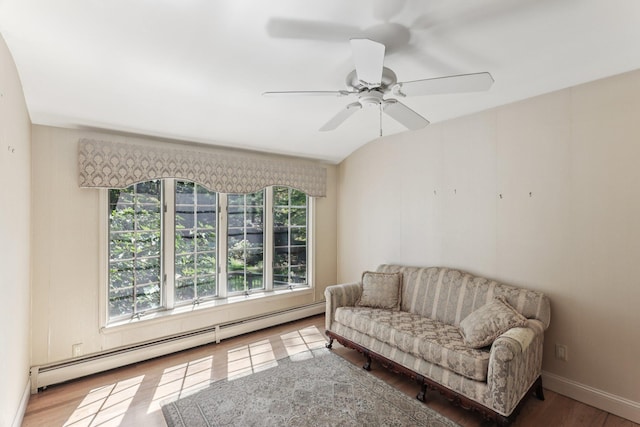 65 Winston Dr, Smithtown, NY 11787 - living area with baseboard heating, wood finished floors, and a ceiling fan