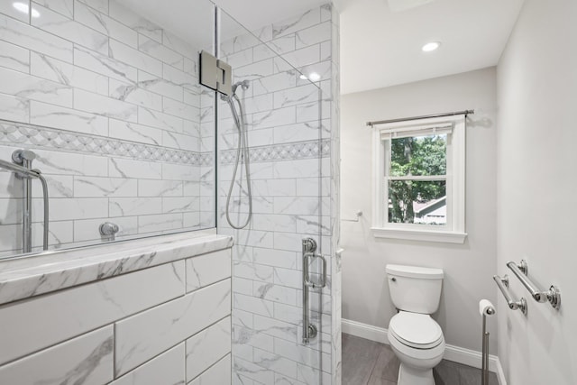 65 Winston Dr, Smithtown, NY 11787 - bathroom with a stall shower, recessed lighting, and wood finished floors