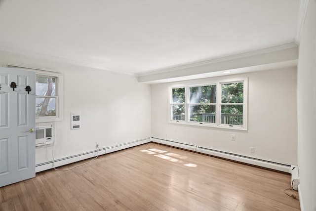 65 Winston Dr, Smithtown, NY 11787 - spare room featuring crown molding, wood finished floors, healthy amount of natural light, and a baseboard radiator