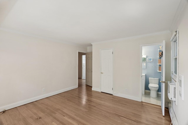 65 Winston Dr, Smithtown, NY 11787 - unfurnished bedroom with ornamental molding, light wood-type flooring, and ensuite bath
