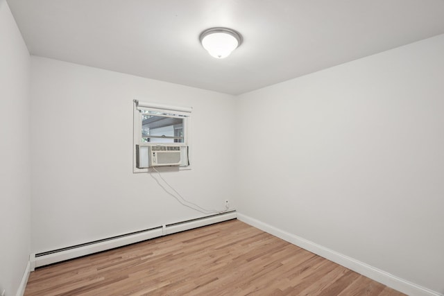 65 Winston Dr, Smithtown, NY 11787 - empty room featuring a baseboard radiator, light wood-type flooring, and cooling unit