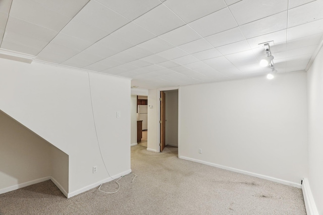 65 Winston Dr, Smithtown, NY 11787 - finished basement featuring light colored carpet, a baseboard radiator, and freestanding refrigerator