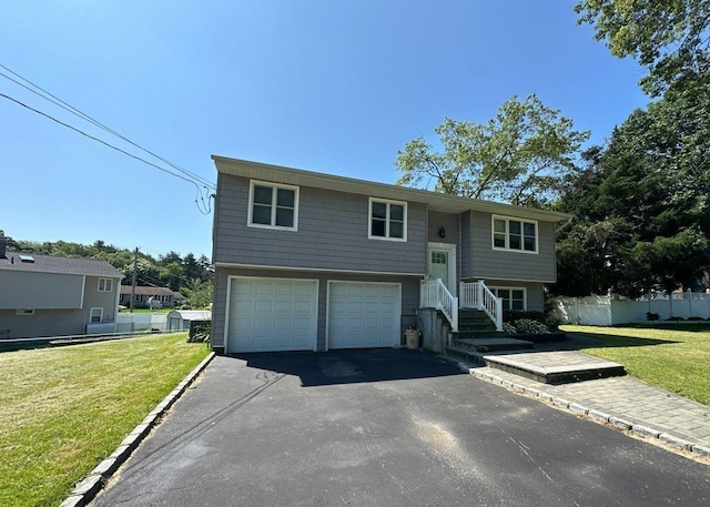 58 Hauppauge Rd, Hauppauge, NY 11788 - raised ranch featuring a garage and driveway