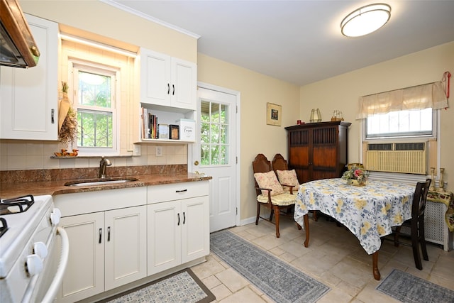 50-40 184th St, Fresh Meadows, NY 11365 - kitchen featuring white gas stove, plenty of natural light, and decorative backsplash