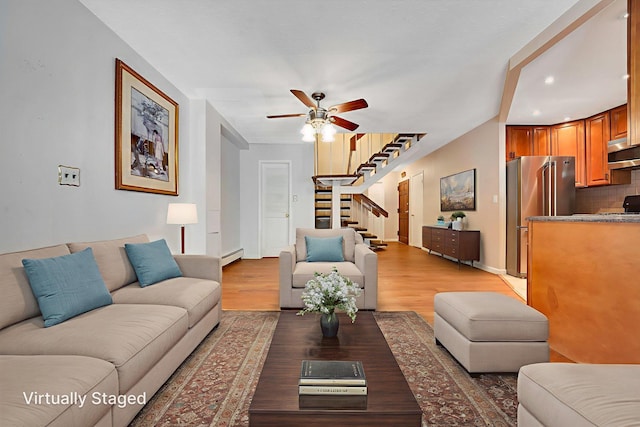 504 Julius Rd Unit 7C, College Point, NY 11356 - living room with ceiling fan, baseboard heating, light wood-style flooring, stairway, and recessed lighting