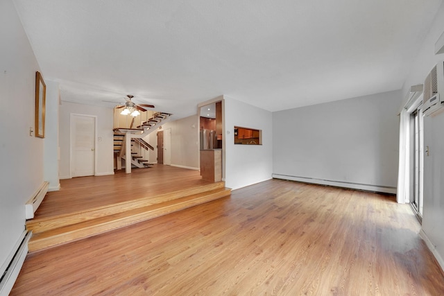 504 Julius Rd Unit 7C, College Point, NY 11356 - unfurnished living room with a baseboard radiator, stairs, and light wood-type flooring