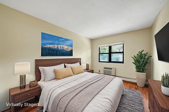 504 Julius Rd Unit 7C, College Point, NY 11356 - bedroom with wood finished floors and an AC wall unit