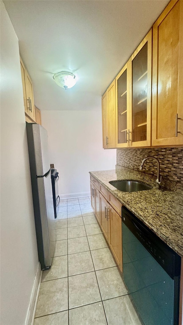 14133 78th Ave Unit 3B, Kew Garden Hills, NY 11367 - kitchen with stainless steel appliances, light tile patterned flooring, backsplash, dark stone countertops, and glass insert cabinets
