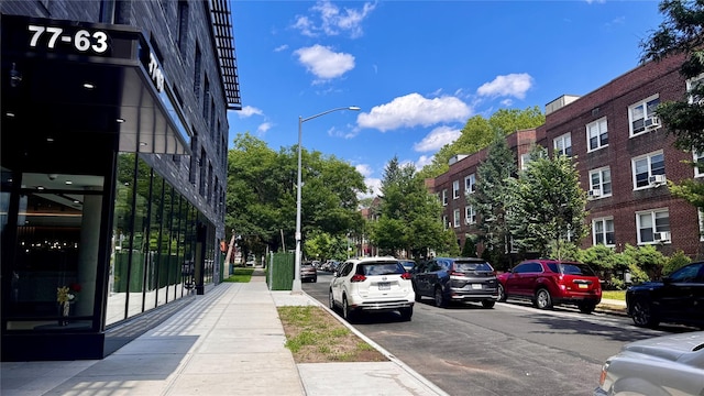 14133 78th Ave Unit 3B, Kew Garden Hills, NY 11367 - view of asphalt street with street lights, sidewalks, and curbs