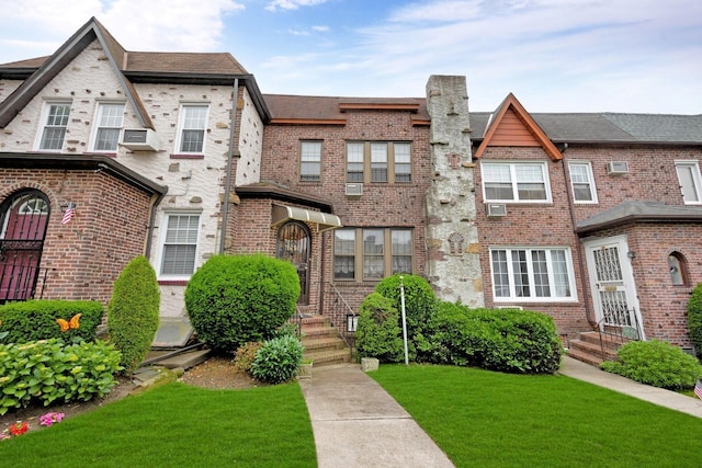 64-66 82nd Pl, Middle Village, NY 11379 - view of front of house featuring a front lawn and brick siding