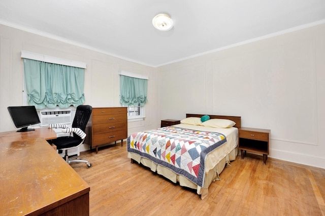 64-66 82nd Pl, Middle Village, NY 11379 - bedroom featuring light wood-style floors, a decorative wall, crown molding, and a desk