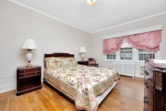64-66 82nd Pl, Middle Village, NY 11379 - bedroom featuring radiator, wood finished floors, and crown molding