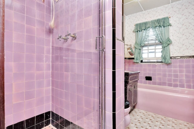 64-66 82nd Pl, Middle Village, NY 11379 - bathroom featuring a stall shower, a garden tub, and tile walls