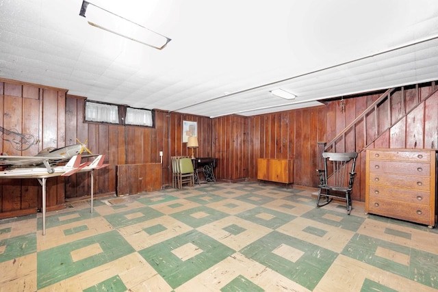 64-66 82nd Pl, Middle Village, NY 11379 - finished basement featuring tile patterned floors, wooden walls, and stairway