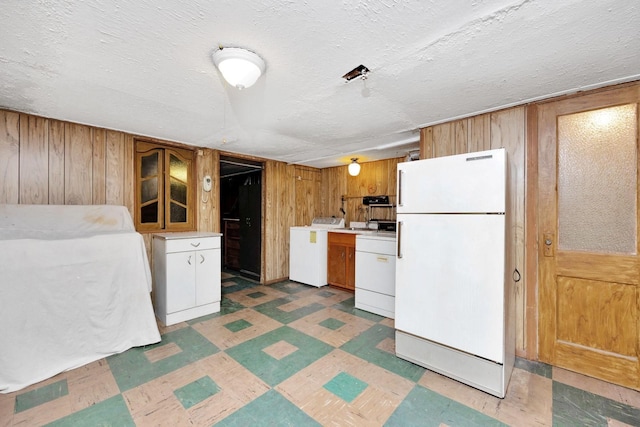 64-66 82nd Pl, Middle Village, NY 11379 - kitchen with freestanding refrigerator, washer / dryer, light flooring, wood walls, and light countertops
