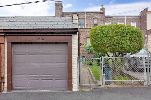 64-66 82nd Pl, Middle Village, NY 11379 - garage featuring a gate