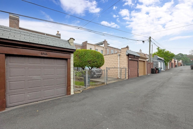 64-66 82nd Pl, Middle Village, NY 11379 - garage featuring a gate