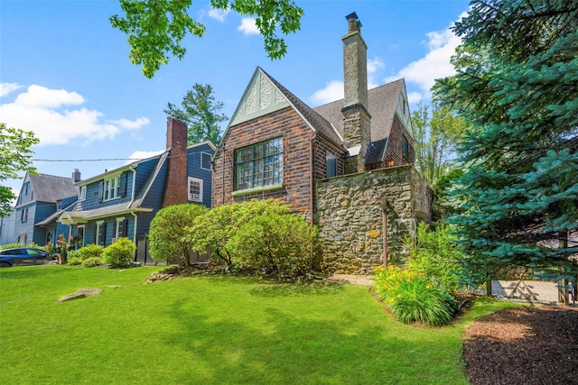 1 Highwood Way, Larchmont, NY 10538 - view of home's exterior featuring a lawn, a chimney, and stone siding