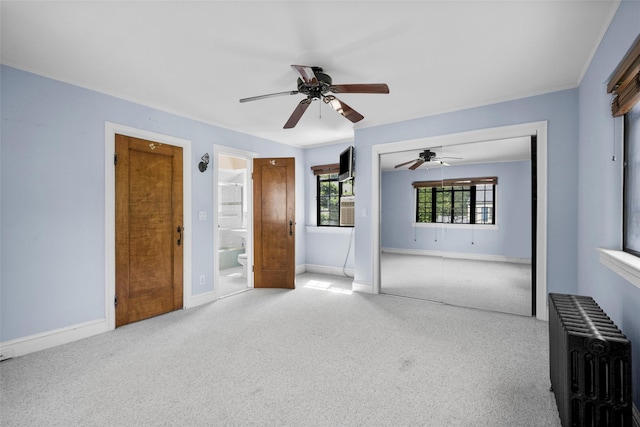 1 Highwood Way, Larchmont, NY 10538 - unfurnished living room featuring radiator, ceiling fan, and carpet