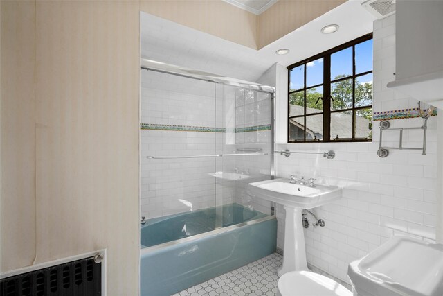 1 Highwood Way, Larchmont, NY 10538 - full bathroom featuring bath / shower combo with glass door, tile walls, crown molding, and tile patterned flooring