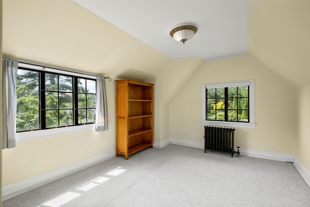 1 Highwood Way, Larchmont, NY 10538 - additional living space featuring radiator heating unit, light colored carpet, plenty of natural light, and lofted ceiling