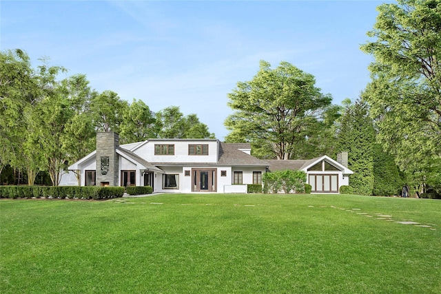 178 Skimhampton Rd, Amagansett, NY 11937 - view of front of home with a chimney and a front yard