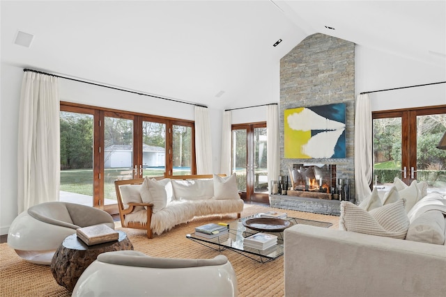 178 Skimhampton Rd, Amagansett, NY 11937 - living area featuring french doors, healthy amount of natural light, a fireplace, and high vaulted ceiling