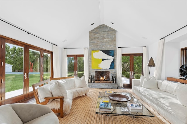 178 Skimhampton Rd, Amagansett, NY 11937 - living room featuring french doors, a stone fireplace, and high vaulted ceiling