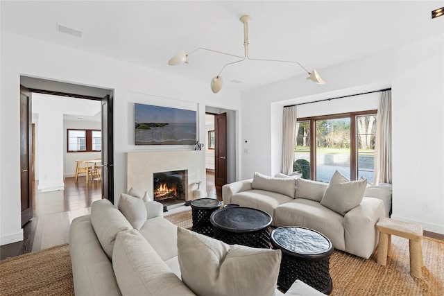 178 Skimhampton Rd, Amagansett, NY 11937 - living area featuring dark wood-style floors, healthy amount of natural light, and a tile fireplace