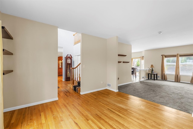 9 June Rd, Chester, NY 10918 - spare room featuring light wood finished floors, stairs, and arched walkways
